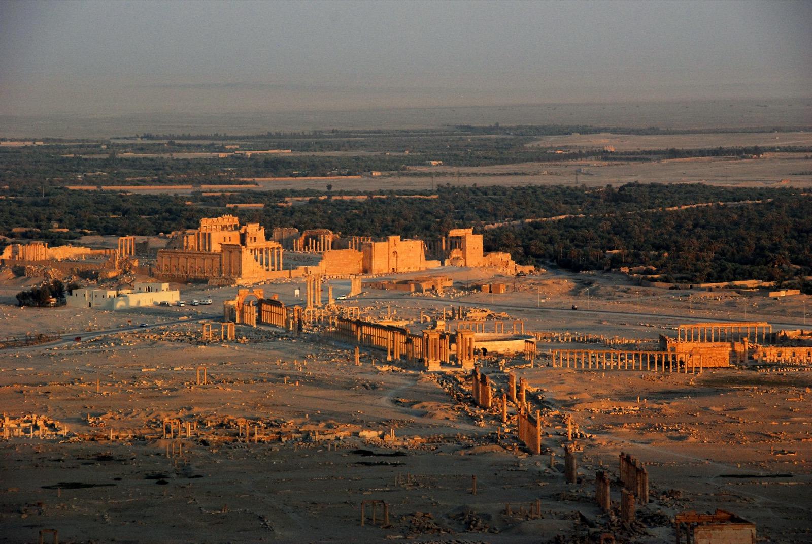 Desert ruins and colonnade at Palmyra, Syria, at sunset