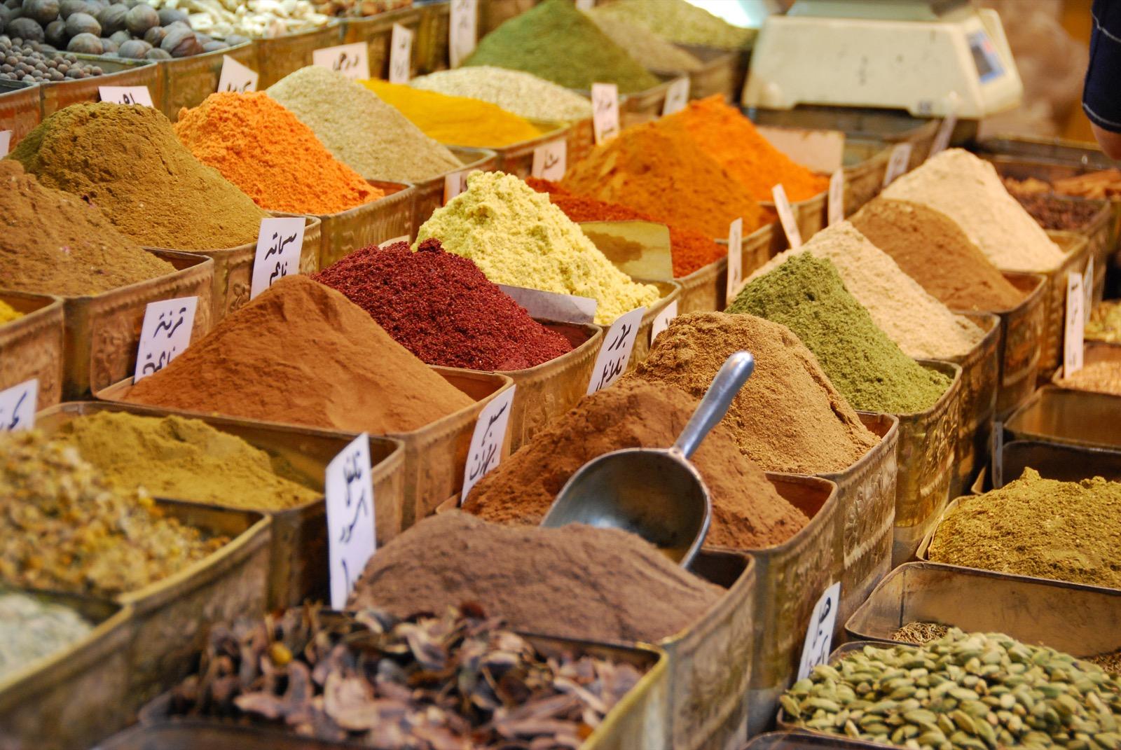Colorful spice market stall in a souq in Damascus